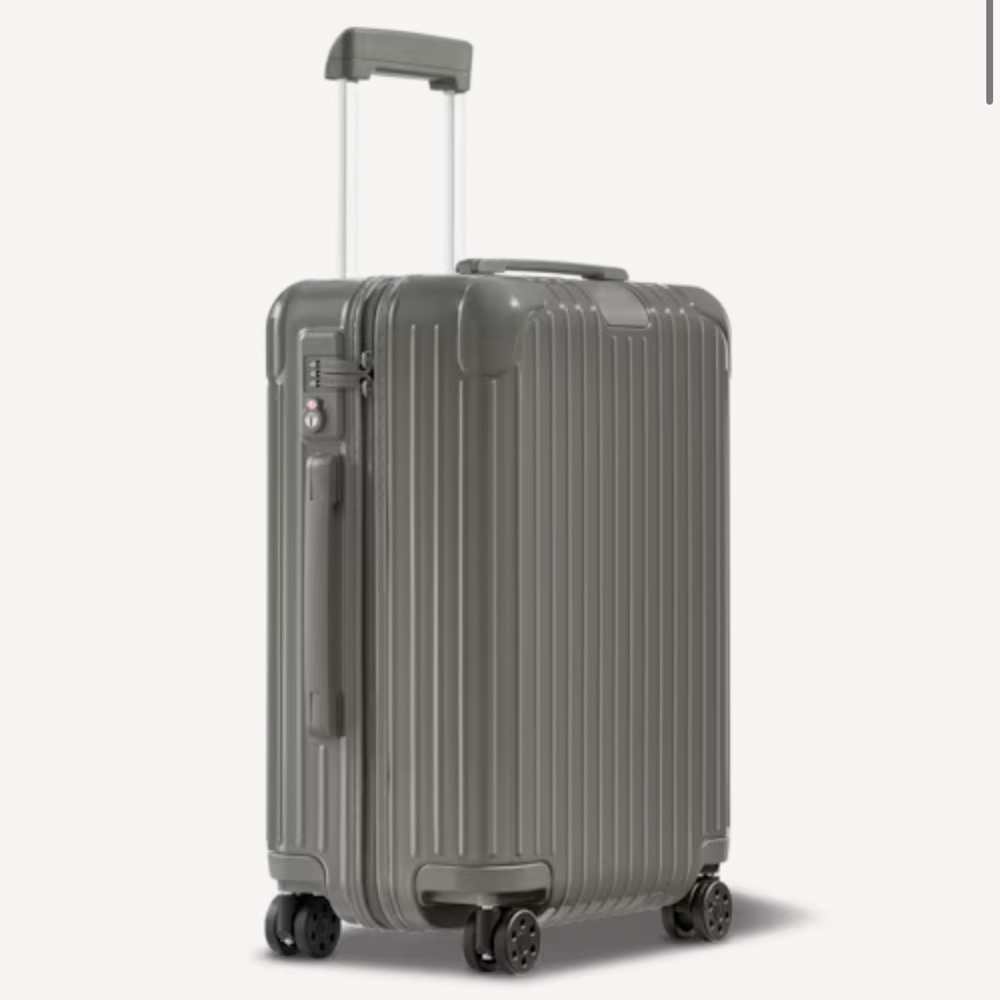 Rimowa Gloss State Grey
Cabin Size: 21.7 x 15.8 x 9.1 inch 

$978.00 after tax.